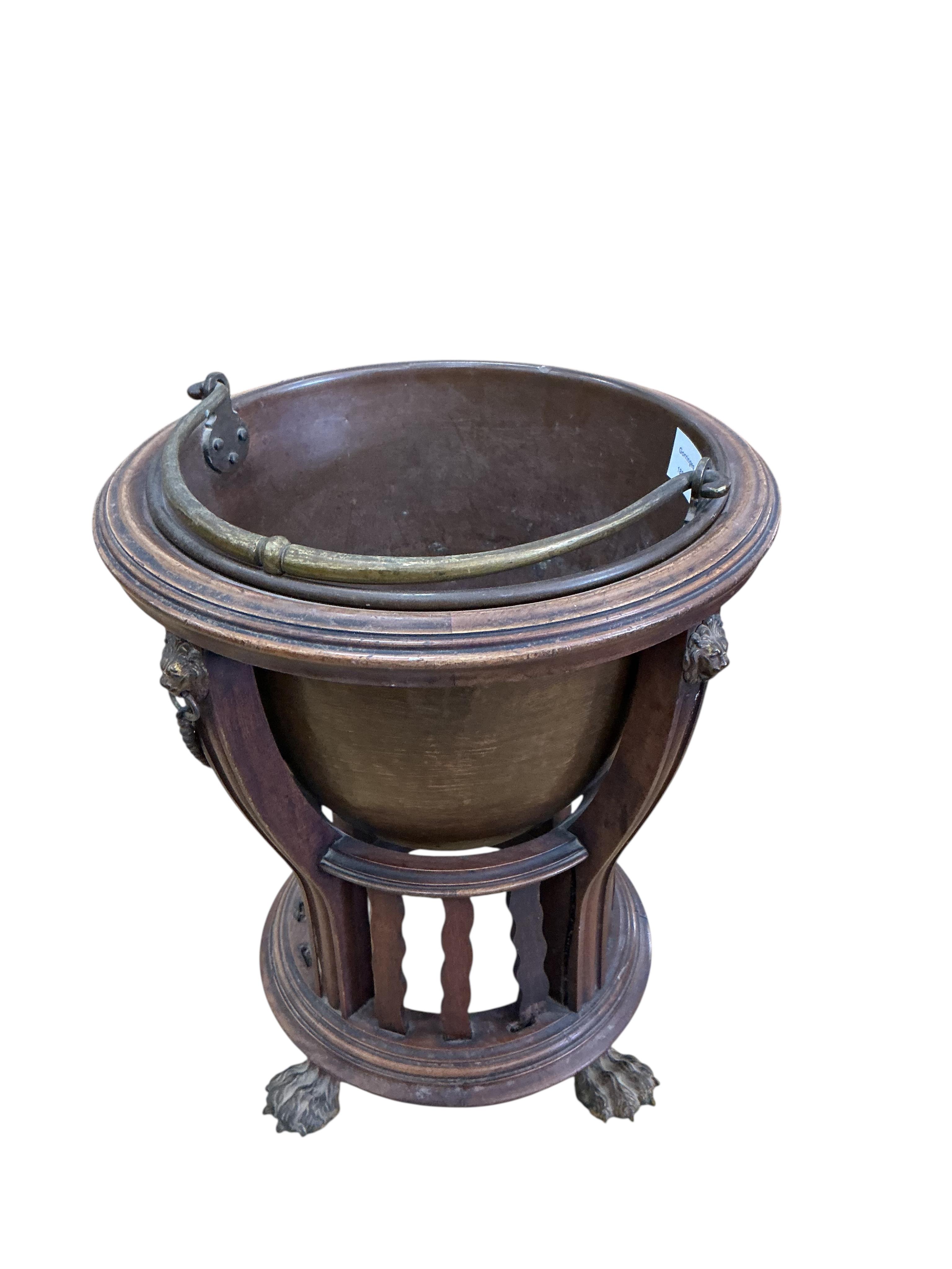 An Edwardian brass mounted circular mahogany coal bucket, with liner, diameter 37cm, height 42cm
